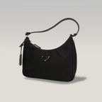 Prada Re-Edition 2005 borsa mini in nylon nero con tracolla – iconica