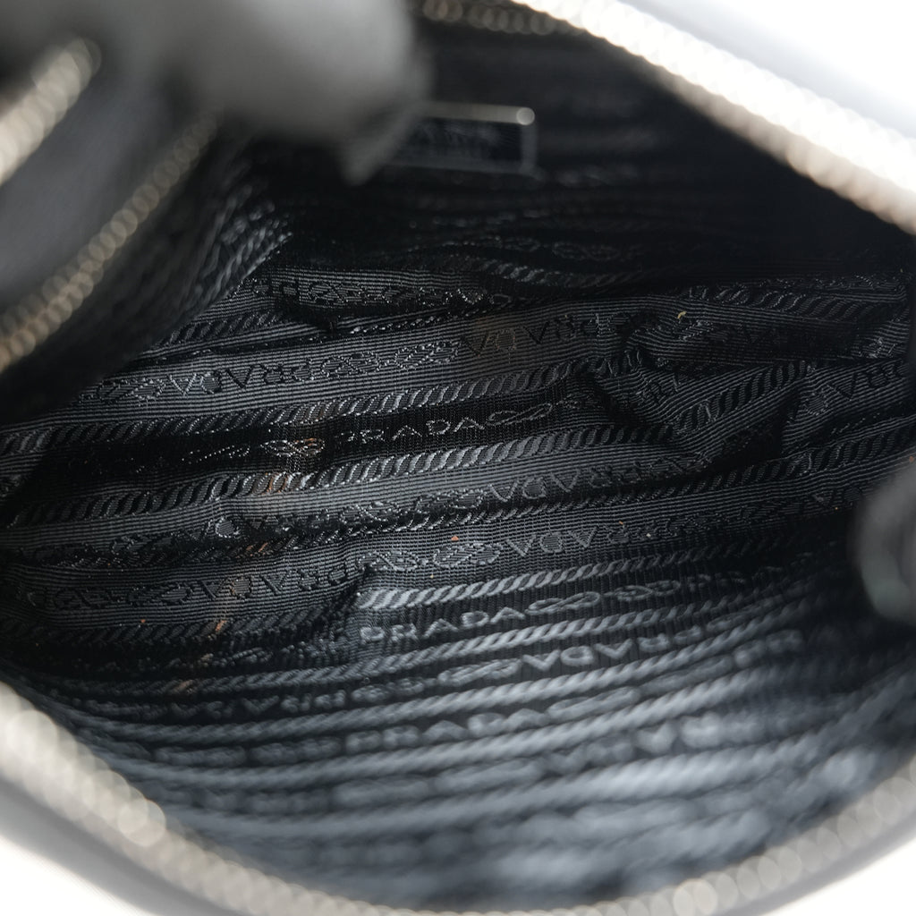 Prada Re-Edition 2005 borsa mini in nylon nero con tracolla – iconica