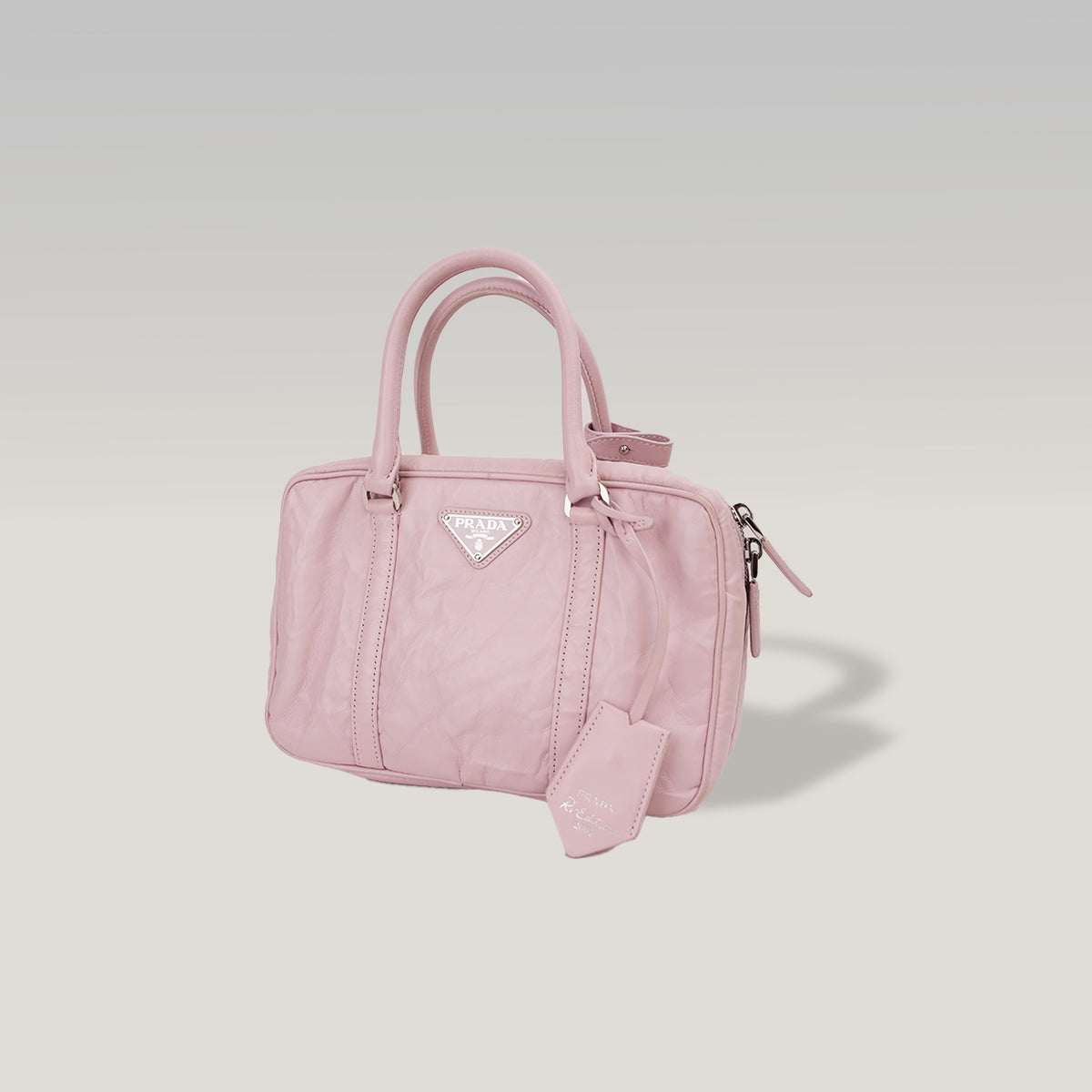 Prada Bauletto Piccolo in Pelle Rosa Cipria con Logo Triangolare e Dettagli Argentati – Dust Bag Inclusa