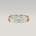 Hermès Bracciale Clic H in Smalto Arancione e Metallo Argentato
