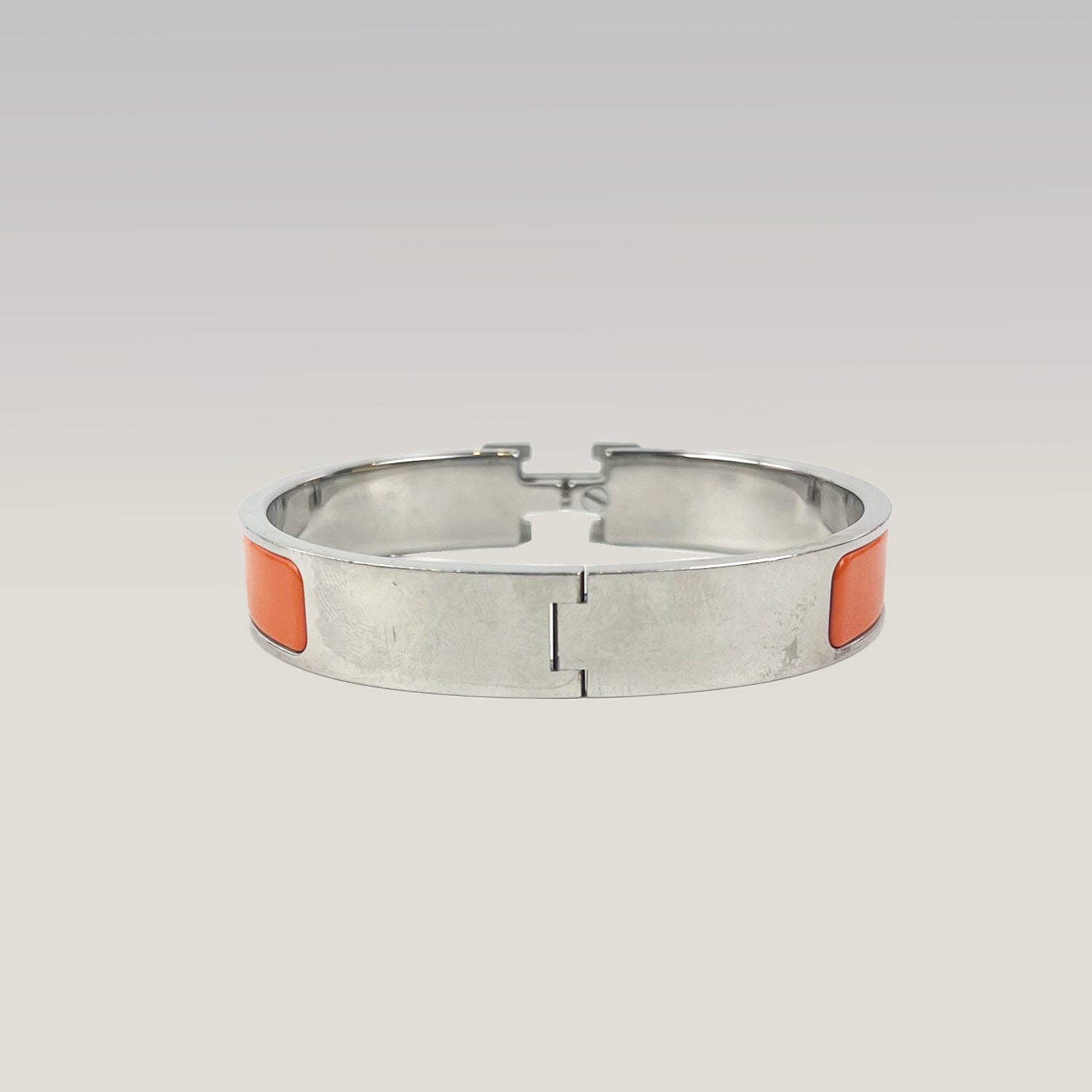 Hermès Bracciale Clic H in Smalto Arancione e Metallo Argentato
