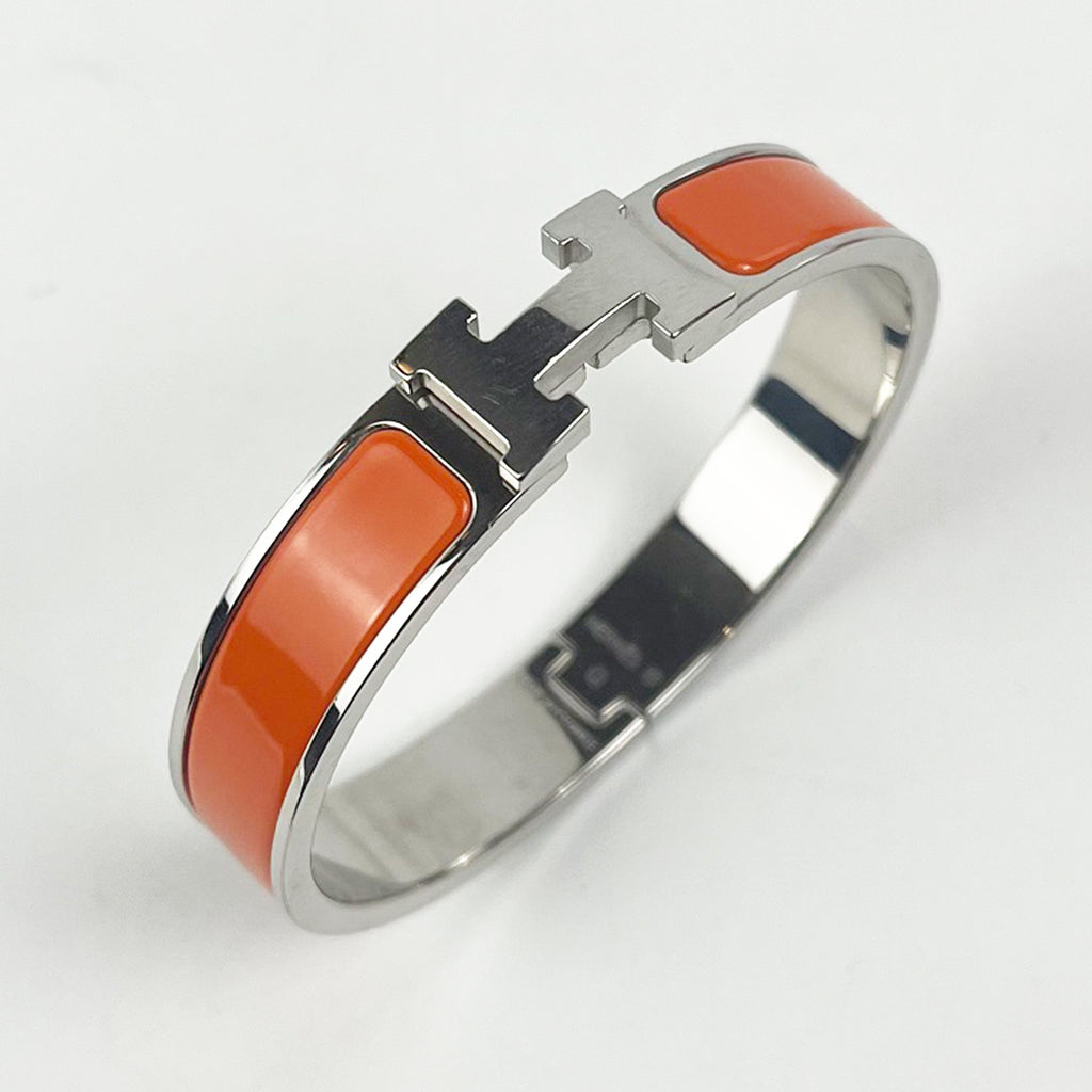 Hermès Bracciale Clic H in Smalto Arancione e Metallo Argentato