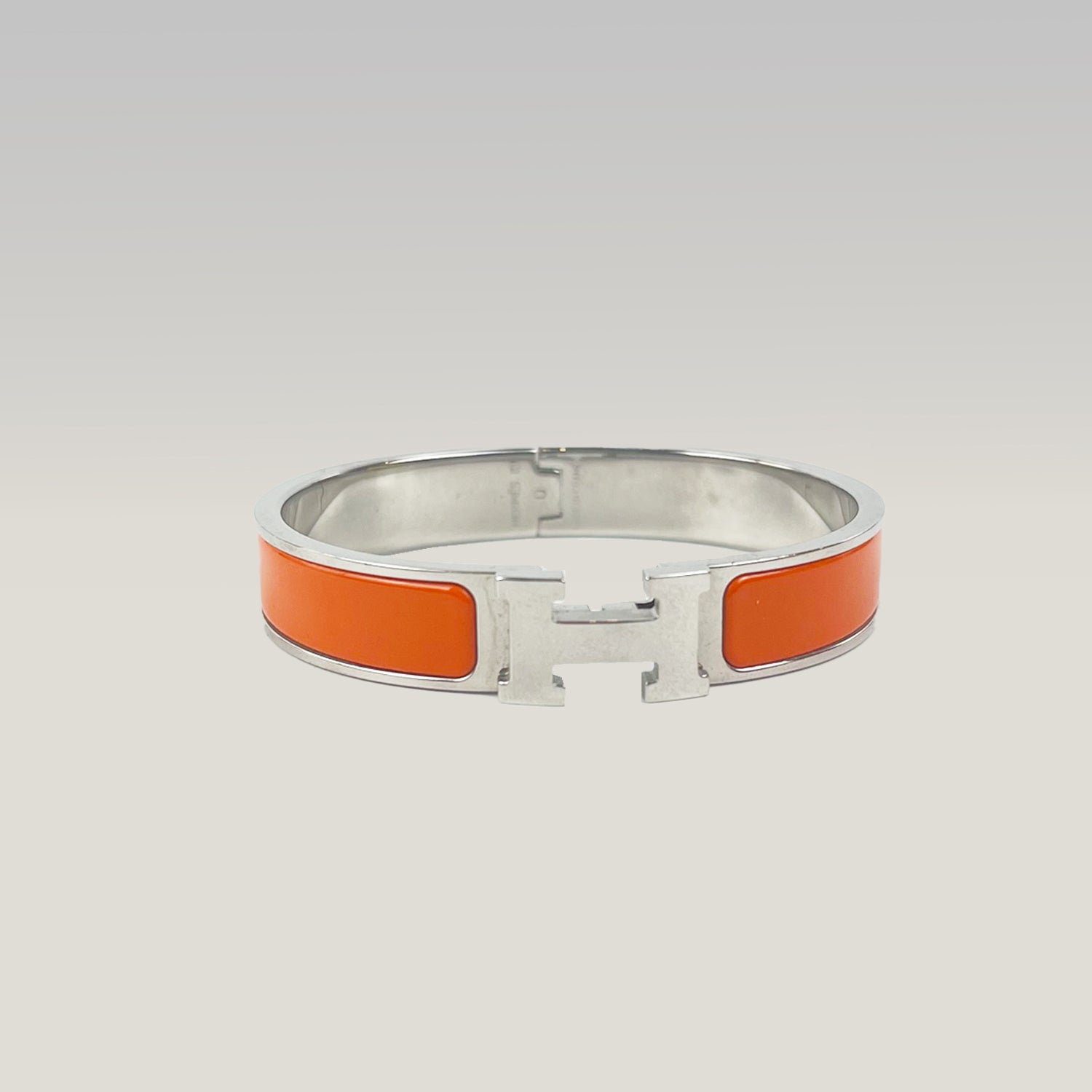 Hermès Bracciale Clic H in Smalto Arancione e Metallo Argentato