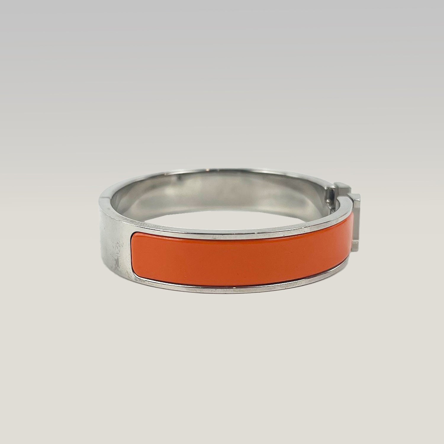 Hermès Bracciale Clic H in Smalto Arancione e Metallo Argentato