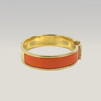 Hermès Bracciale Clic H Arancione e Oro in Smalto con Logo H Iconico