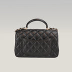 Chanel Mini Classic Flap con Manico in Pelle di Agnello Nera Matelassé e Metallo Dorato