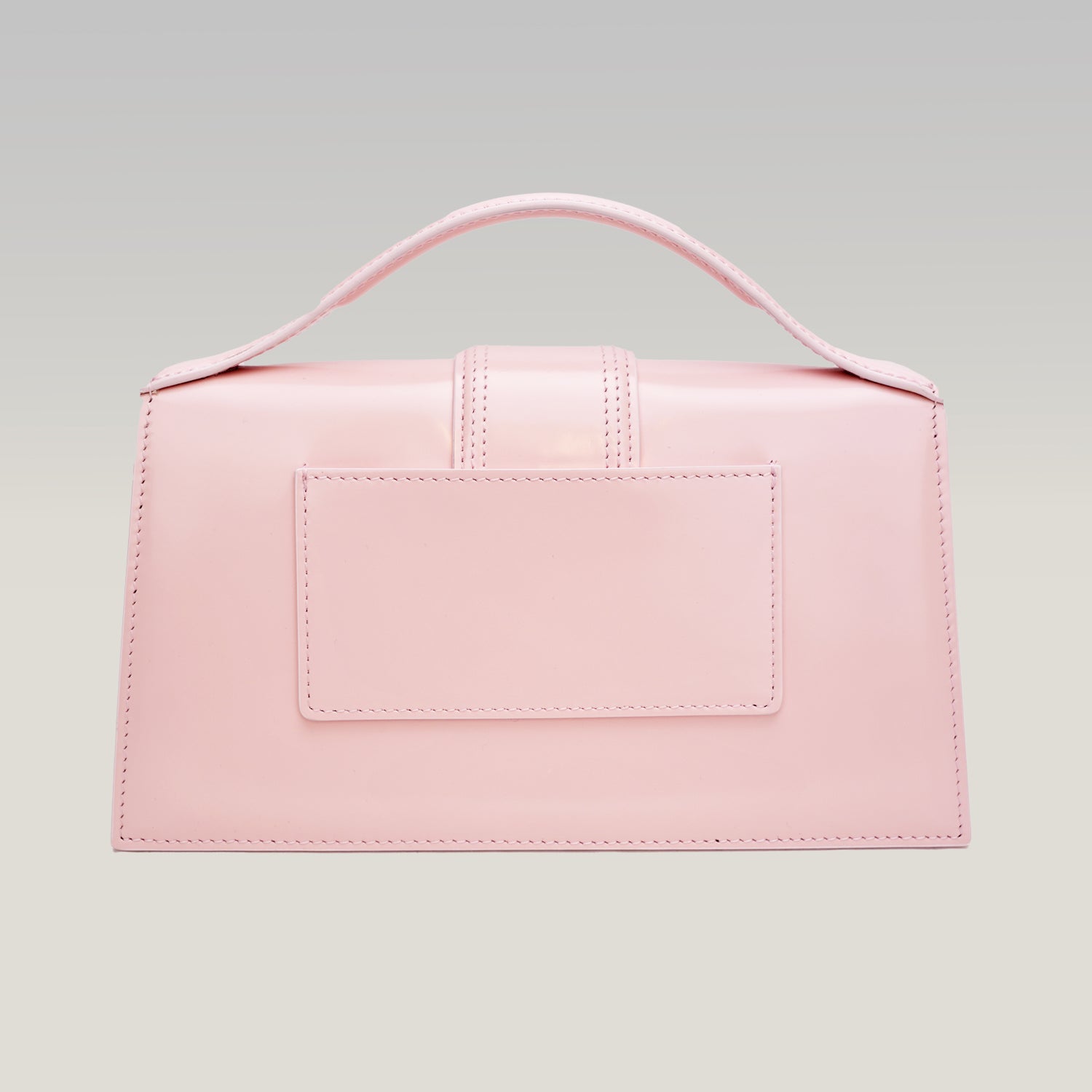 Jacquemus Le Grand Bambino Rosa Pallido in Pelle Verniciata con Manico e Tracolla