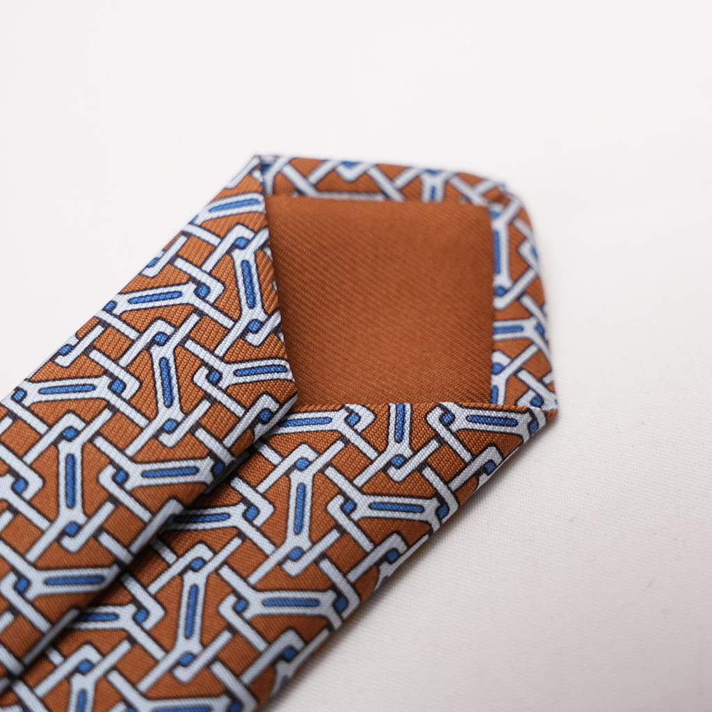Hermès Elegant Multicolor Geometric Pattern Silk Tie