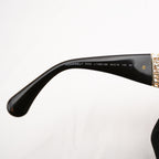 Chanel occhiali da sole neri con aste dorate effetto intrecciato CC