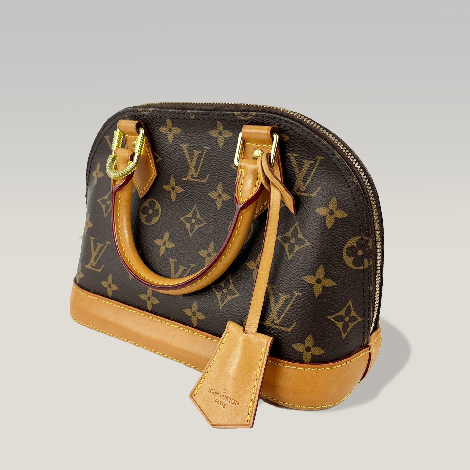 Louis Vuitton Alma BB Monogram Canvas con Charm in Pelle