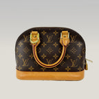 Louis Vuitton Alma BB Monogram Canvas con Charm in Pelle