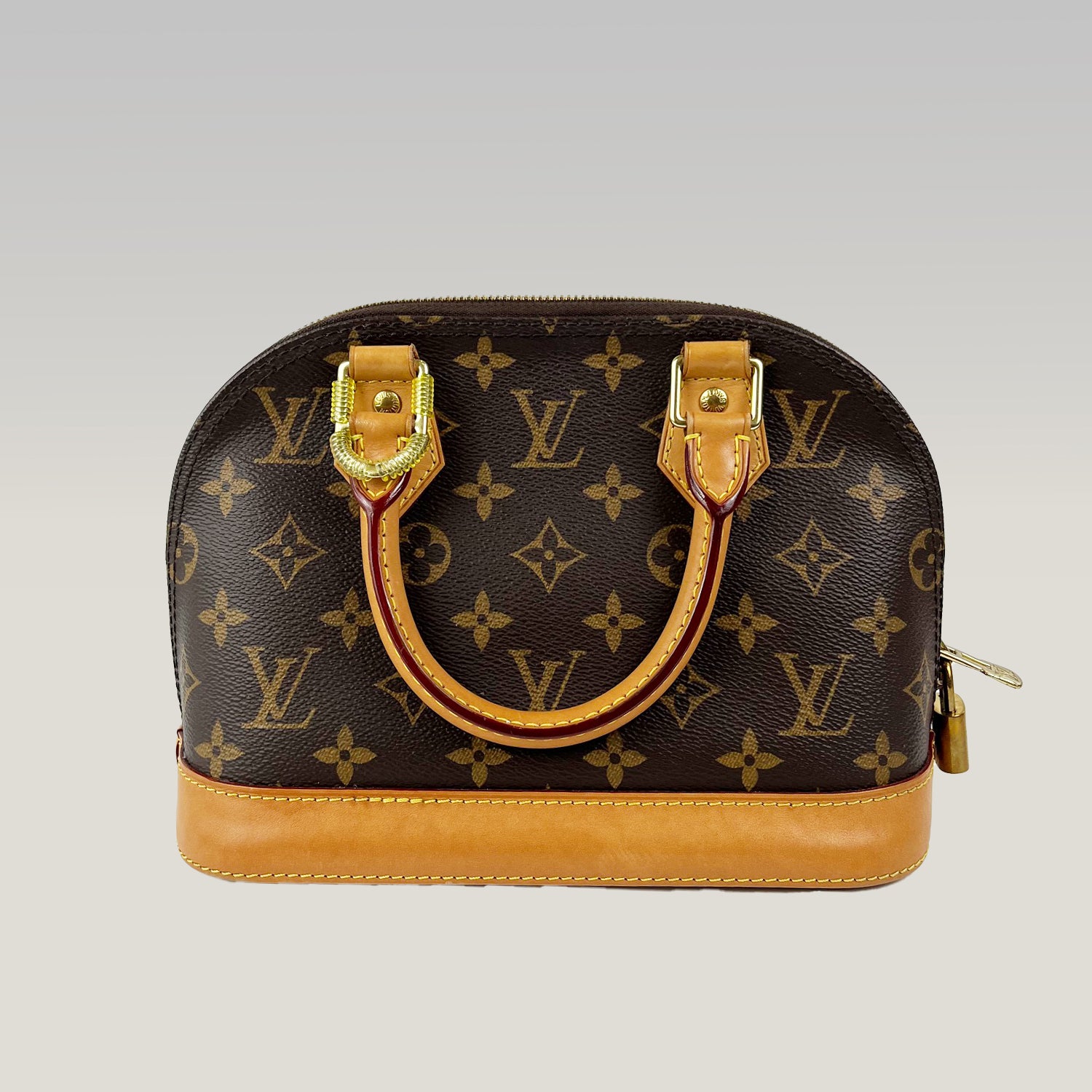 Louis Vuitton Alma BB Monogram Canvas con Charm in Pelle
