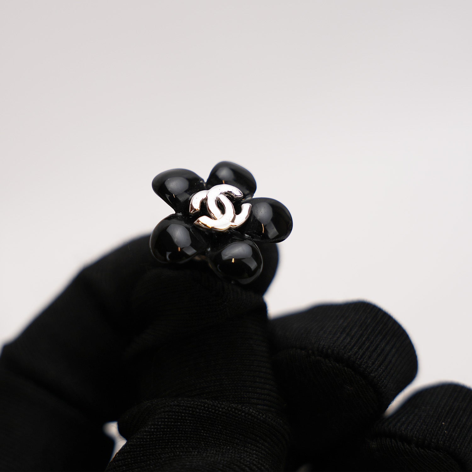 CHANEL Black Flower Heart Logo Stud Earrings