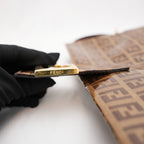 Fendi Baguette – brown FF monogram shoulder bag in crystal-effect leather 