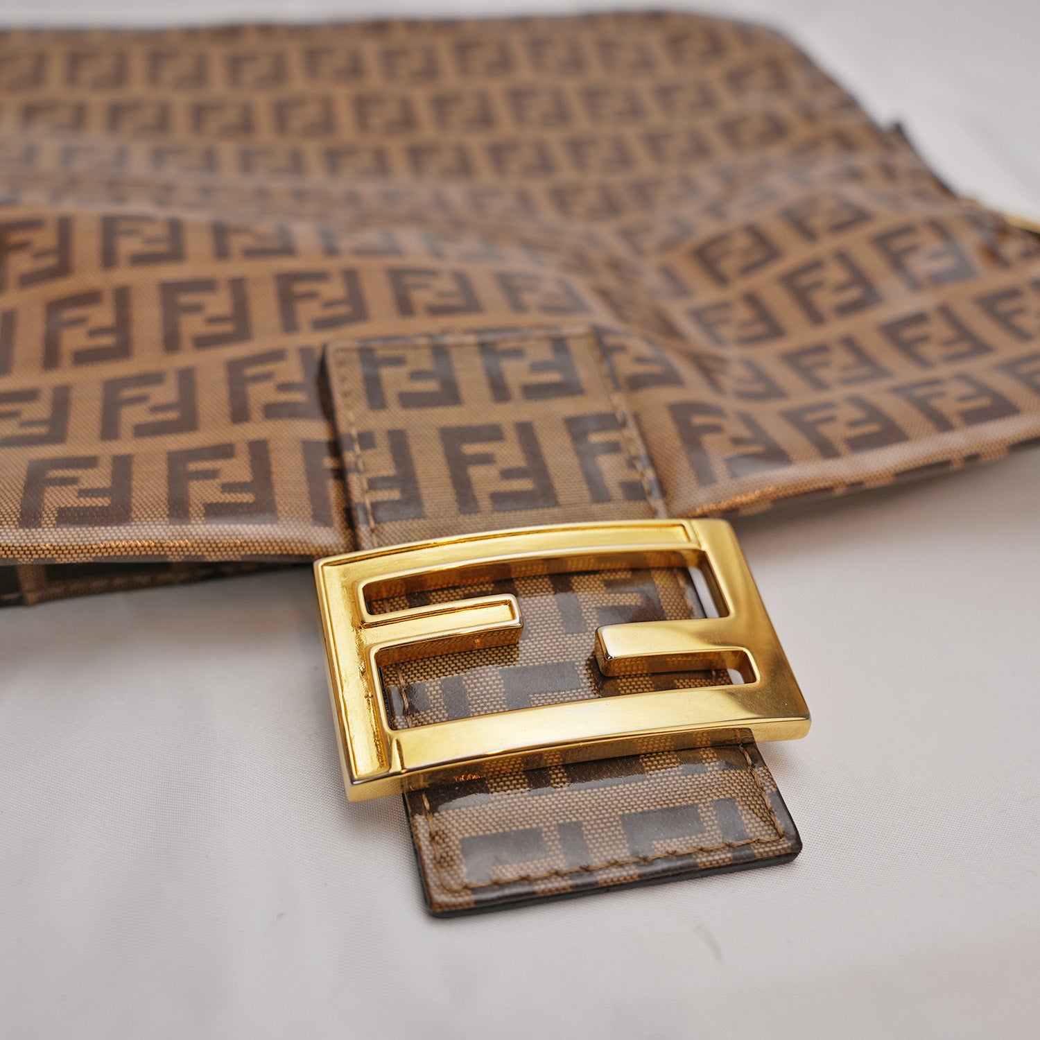 Fendi Baguette – brown FF monogram shoulder bag in crystal-effect leather 