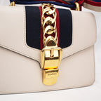 Gucci Sylvie Mini white leather bag with Web ribbon and gold chain