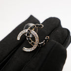 CHANEL Orecchini CC Intrecciati con Strass