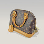 Louis Vuitton Alma BB Monogram Canvas con Finiture in Pelle Naturale