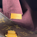 Borsa Louis Vuitton Montaigne MM in Tela Monogram Marrone con Manici in Pelle