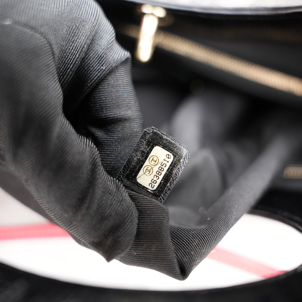 Chanel 31 in tela trapuntata floreale e pelle nera