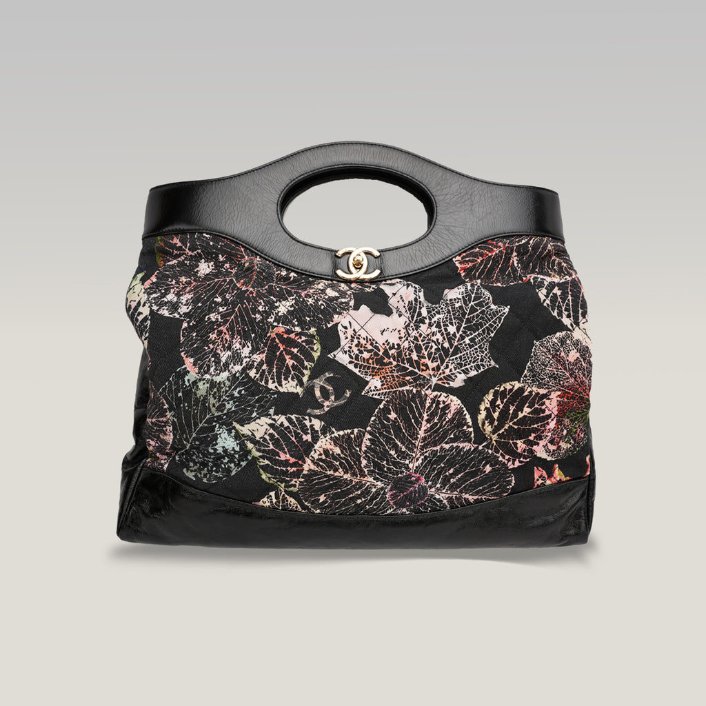 Chanel 31 in tela trapuntata floreale e pelle nera
