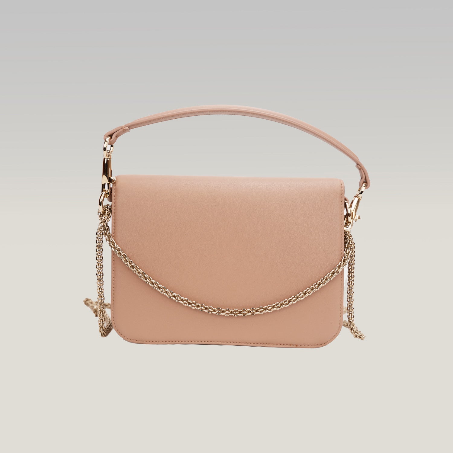 Valentino Loco – clutch in tela rosa nude con logo V gioiello