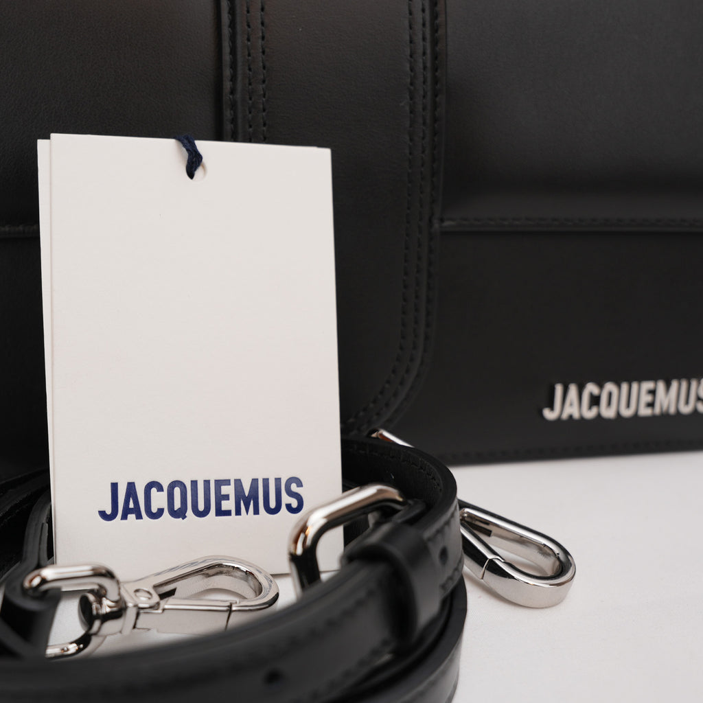 Jacquemus Il Grande Bambino nero con logo argento