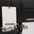 Jacquemus Il Grande Bambino nero con logo argento