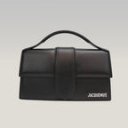 Jacquemus Il Grande Bambino nero con logo argento