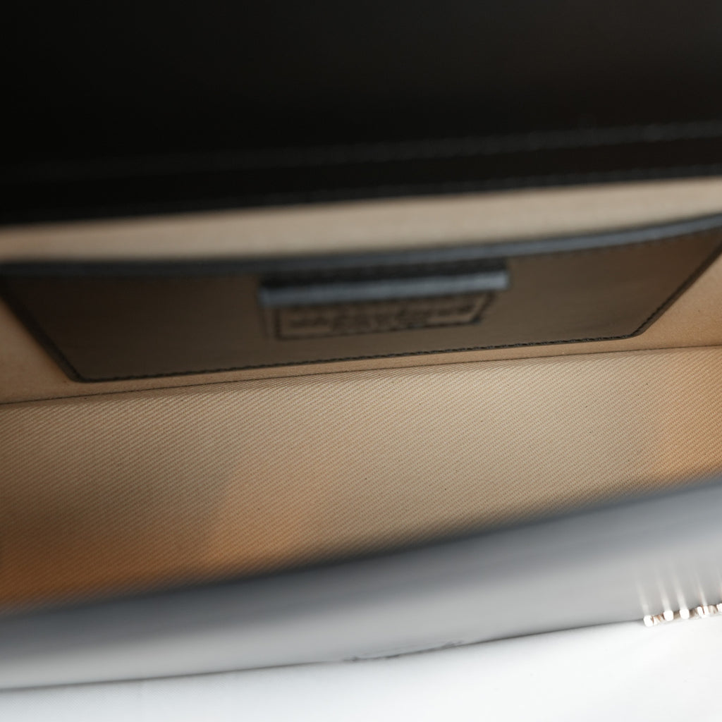 Jacquemus Il Grande Bambino nero con logo argento