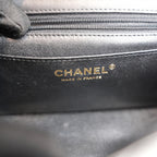 Chanel Mini Classic Flap con Manico in Pelle di Agnello Nera Matelassé e Metallo Dorato