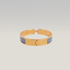 Hermès Clic H PM Bracciale Rigido in Metallo Dorato con Smalto Blu