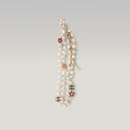 Chanel Collana Lunga Vintage del 2009 con Perle Bianche, Charm Camelia e Logo CC in Metallo Dorato