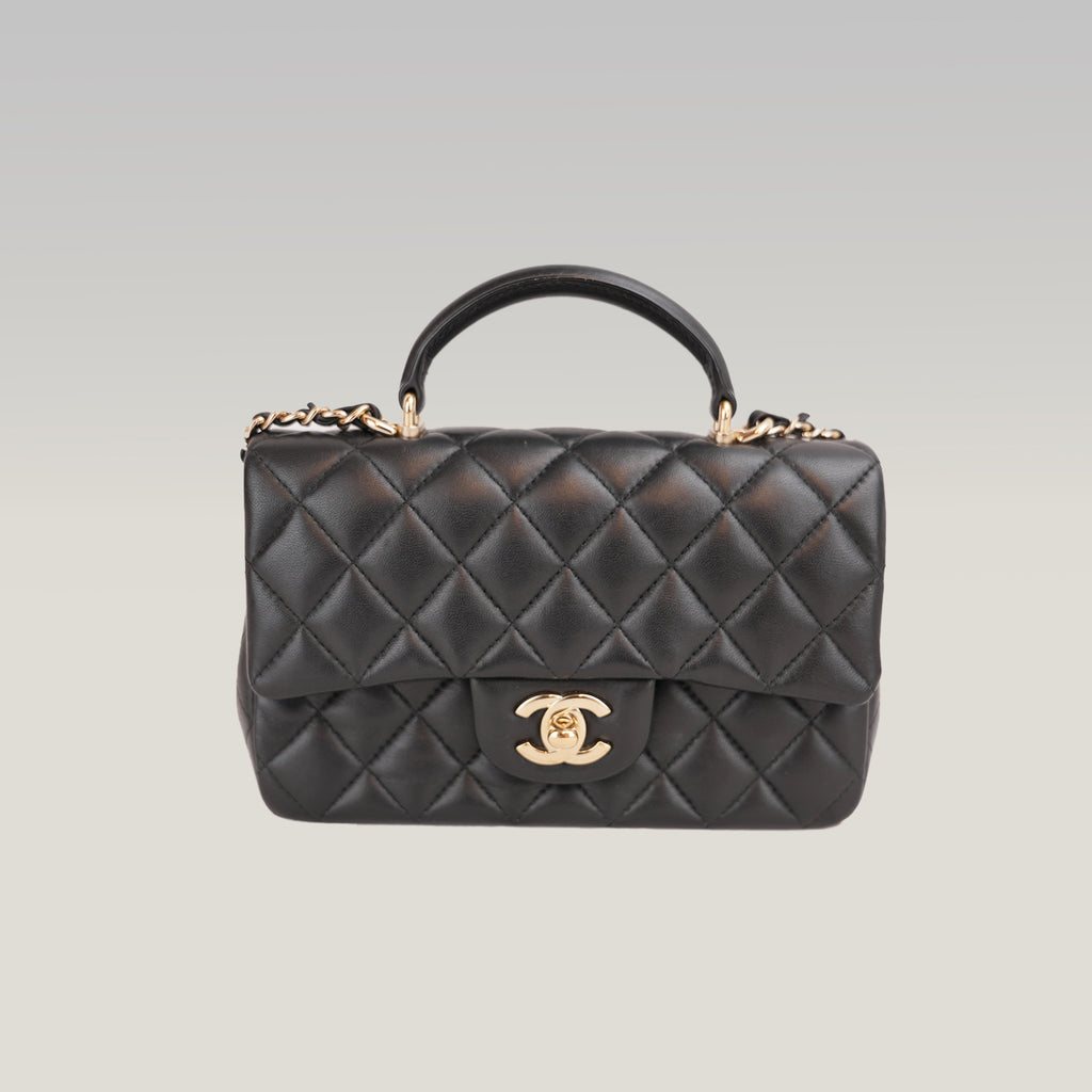 Chanel Mini Classic Flap con Manico in Pelle di Agnello Nera Matelassé e Metallo Dorato