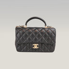 Chanel Mini Classic Flap con Manico in Pelle di Agnello Nera Matelassé e Metallo Dorato