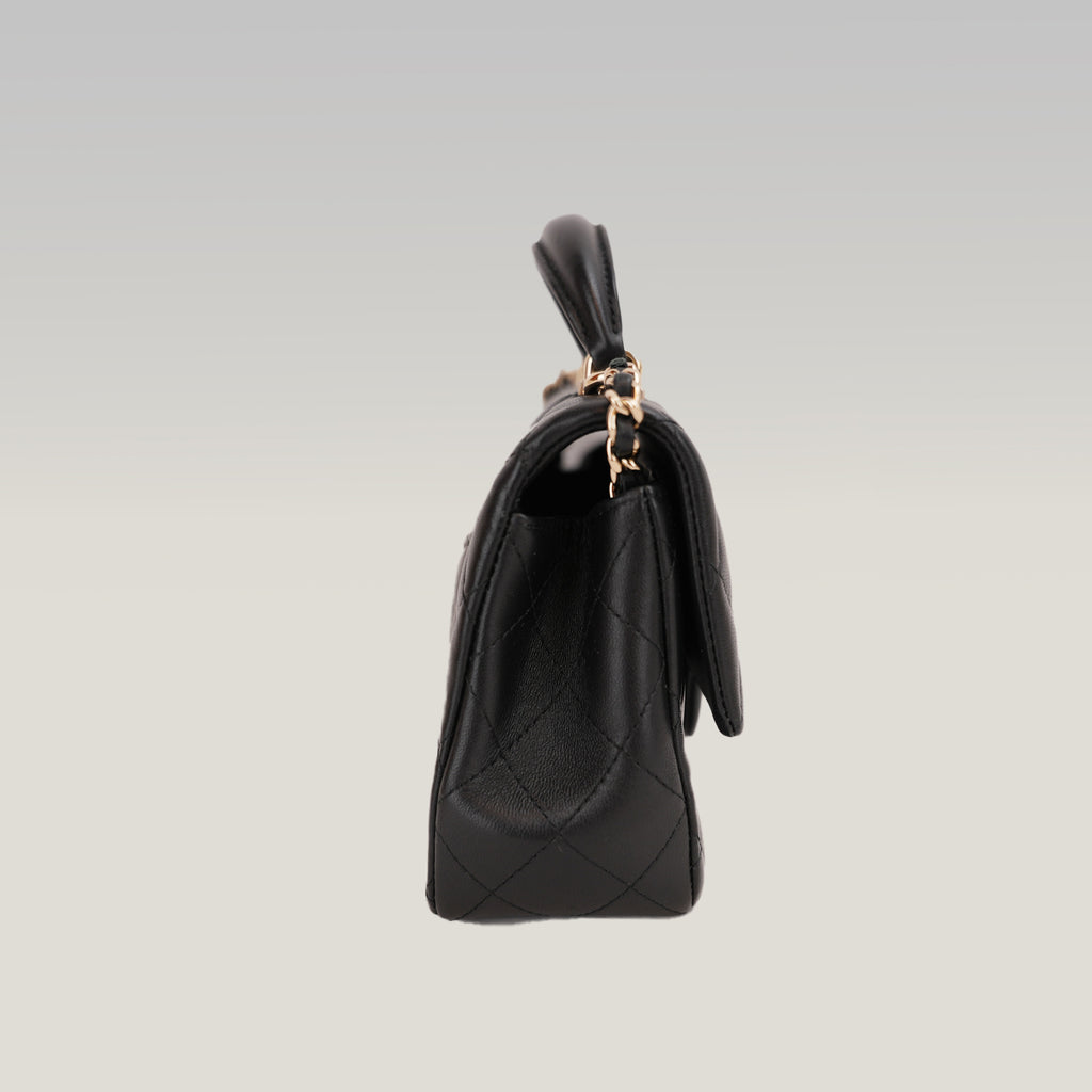 Chanel Mini Classic Flap con Manico in Pelle di Agnello Nera Matelassé e Metallo Dorato