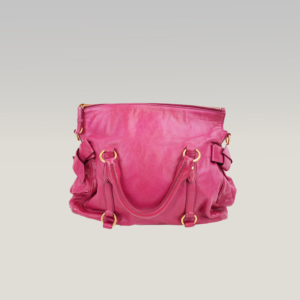 Miu Miu Vitello Bow Bag Borsa a Mano in Pelle Cerata Rosa Fucsia con Fiocchi Laterali e Dettagli Dorati