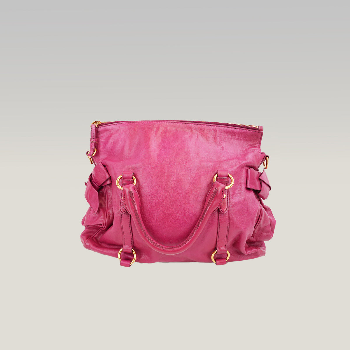 Miu Miu Vitello Bow Bag Borsa a Mano in Pelle Cerata Rosa Fucsia con Fiocchi Laterali e Dettagli Dorati