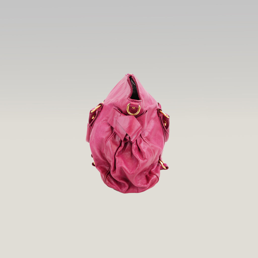 Miu Miu Vitello Bow Bag Borsa a Mano in Pelle Cerata Rosa Fucsia con Fiocchi Laterali e Dettagli Dorati