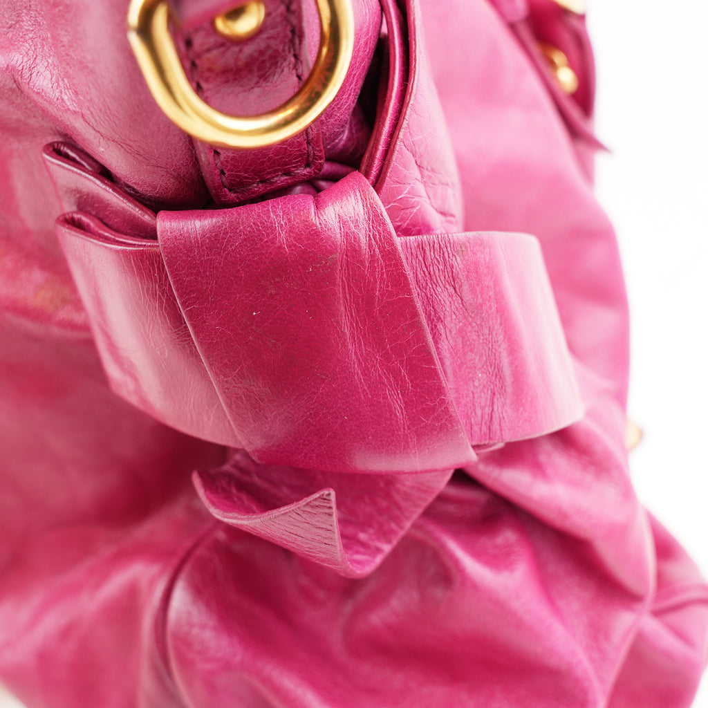 Miu Miu Vitello Bow Bag Borsa a Mano in Pelle Cerata Rosa Fucsia con Fiocchi Laterali e Dettagli Dorati