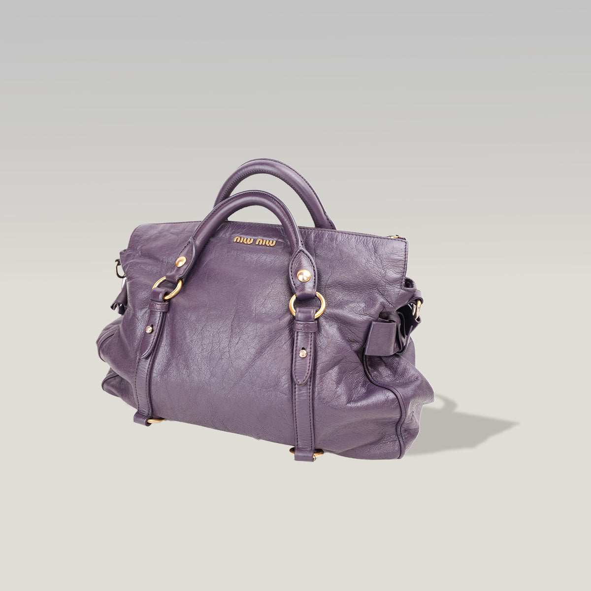 Miu Miu Vitello Lux Bow Borsa a Mano in Pelle Viola Effetto Vintage con Dettagli Dorati