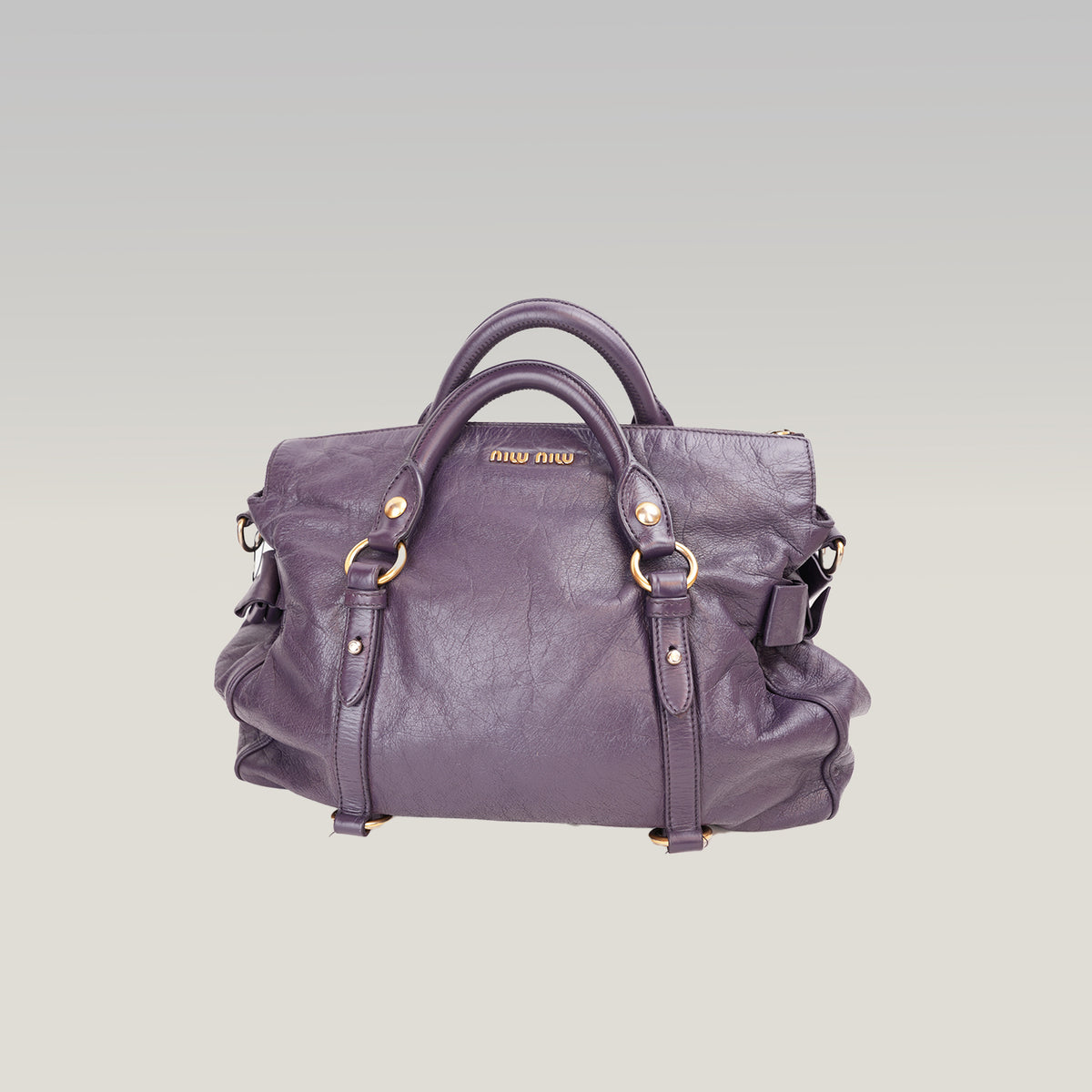Miu Miu Vitello Lux Bow Borsa a Mano in Pelle Viola Effetto Vintage con Dettagli Dorati