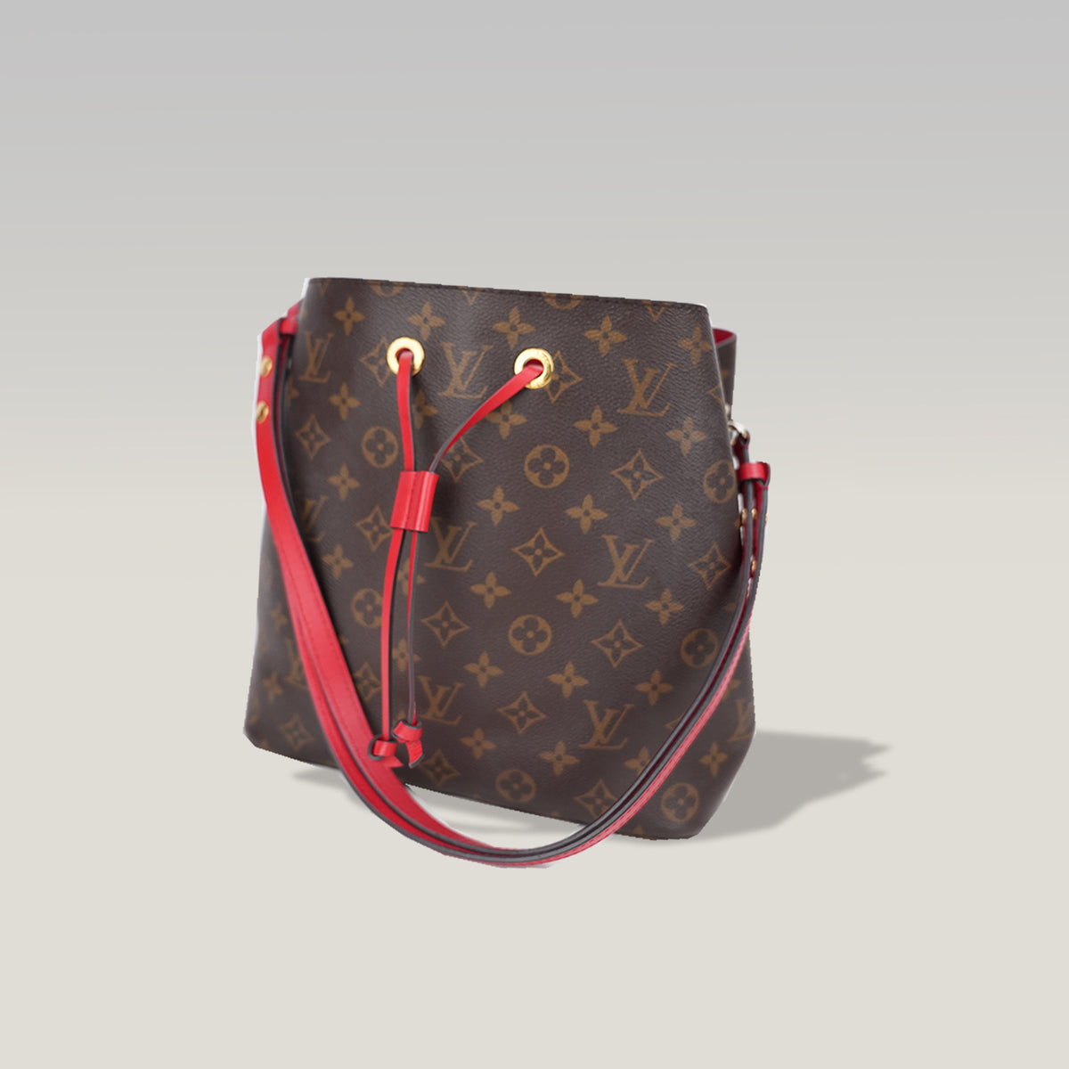 Louis Vuitton NéoNoé MM Monogram in Tela Cerata Marrone con Dettagli Rossi