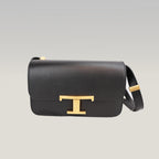 Tod’s Timeless Black Leather Micro Flap Bag con T Logo Oro