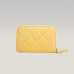 Portafoglio CHANEL in pelle trapuntata gialla con zip