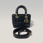 DIOR Lady Dior Piccola Nera in Pelle Cannage con Hardware Dorato e Charm D.I.O.R.