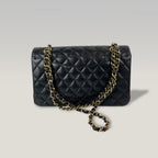 Chanel Medium Classic Flap Bag Nera in Pelle Caviar Trapuntata