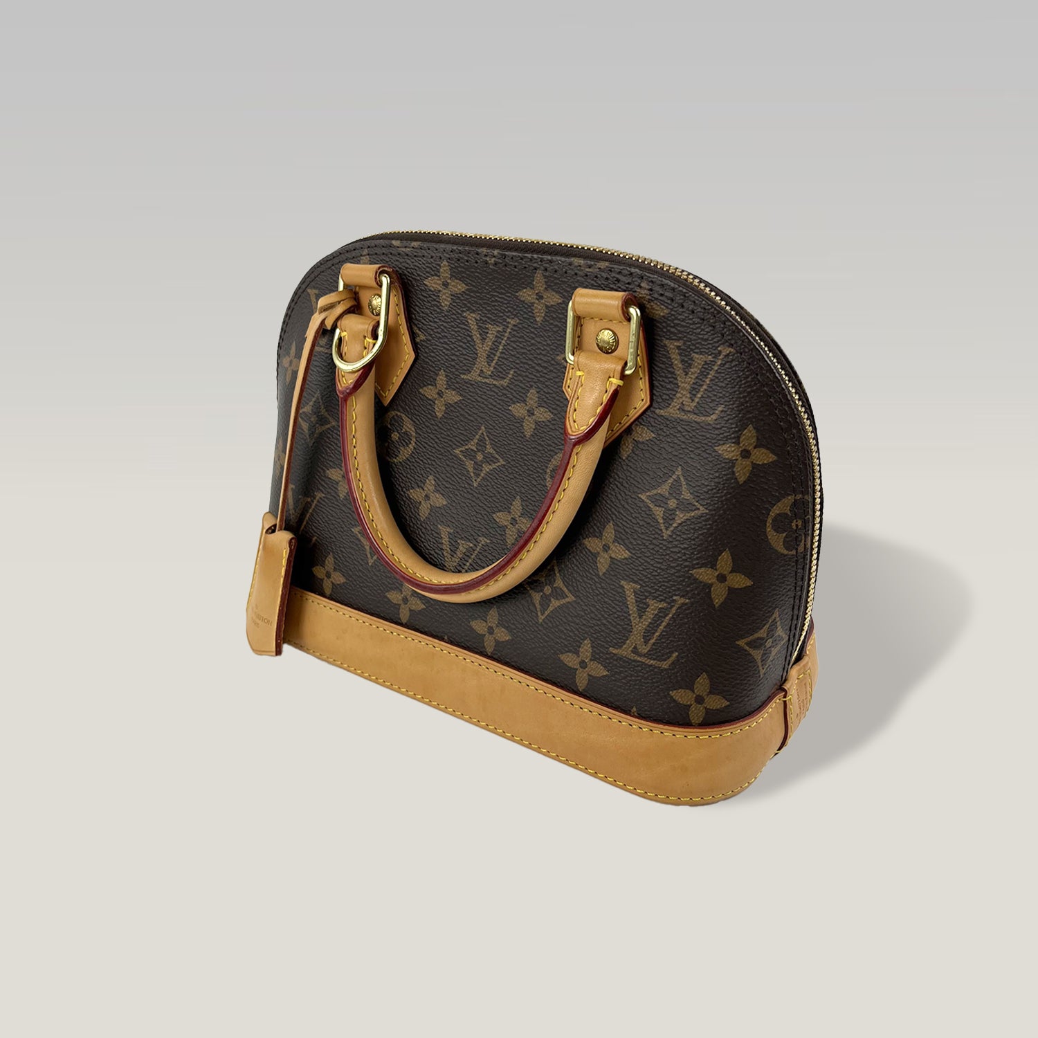 LOUIS VUITTON Alma BB Monogram con Pelle Naturale