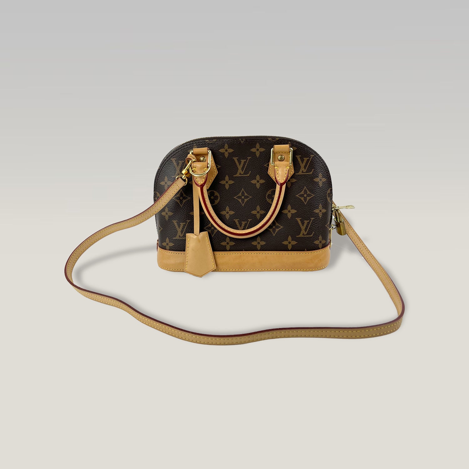 LOUIS VUITTON Alma BB Monogram con Pelle Naturale