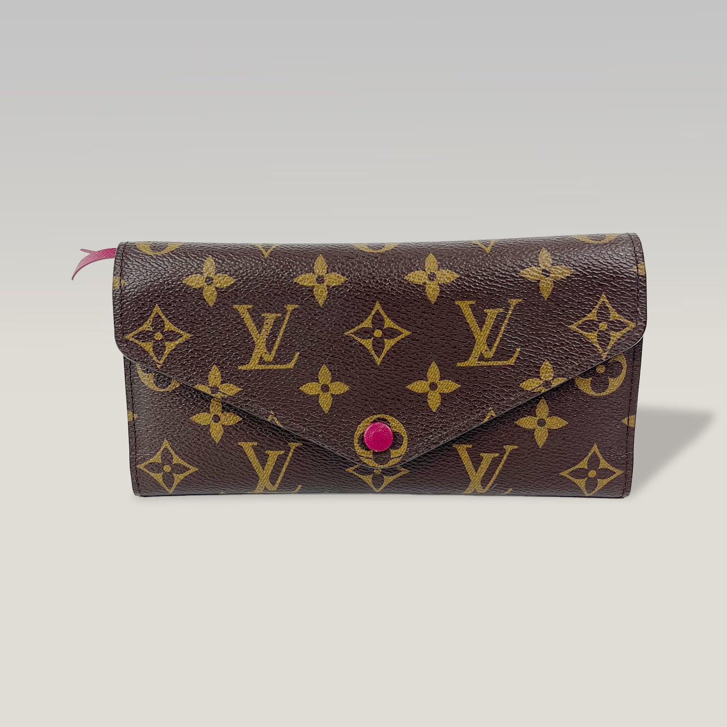 Louis Vuitton portafoglio Monogram con bottone fucsia e tasca estraibile